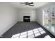 The light-filled living room has a fireplace and French doors to a rear deck at 4601 Pemberton Dr, Raleigh, NC 27609