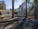 The deck is an extension of the house and has a metal chimney and wood railings at 471 Deer Run, Pittsboro, NC 27312