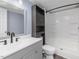 Updated bathroom featuring a modern vanity with sleek fixtures and a shower-tub combo with storage at 471 Deer Run, Pittsboro, NC 27312