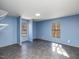 Bedroom with two windows and blue walls; minimalist design, offering a serene and bright space at 471 Deer Run, Pittsboro, NC 27312