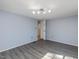 Bright bedroom with wood-look floors, contemporary lighting, and ample space for furnishings at 471 Deer Run, Pittsboro, NC 27312