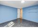Bedroom with shelving, featuring blue walls, neutral flooring, and ample space at 471 Deer Run, Pittsboro, NC 27312