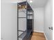 Modern open closet shelving unit with wood accents offers storage and organization in a compact space at 471 Deer Run, Pittsboro, NC 27312