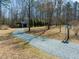 A gravel driveway leads to a large metal shed at 471 Deer Run, Pittsboro, NC 27312