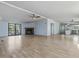 Spacious living room with fireplace, hardwood floors, ceiling fan, and natural light at 471 Deer Run, Pittsboro, NC 27312