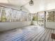 Screened porch with wood flooring and views of the surrounding trees at 471 Deer Run, Pittsboro, NC 27312