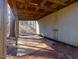 Exterior view of shed with overhanging roof set on a grassy lot at 471 Deer Run, Pittsboro, NC 27312