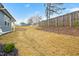 Grassy backyard featuring a wooden fence and well-maintained lawn, ideal for outdoor activities at 501 Campbell Ridge Pl, Wendell, NC 27591