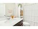 Clean bathroom featuring a vanity, mirror, toilet, and shower with a white curtain, creating a fresh, functional space at 501 Campbell Ridge Pl, Wendell, NC 27591
