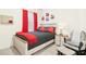 Cozy bedroom with a bed, red accents, and comfortable chair, creating a warm and inviting personal space at 501 Campbell Ridge Pl, Wendell, NC 27591