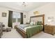 Comfortable bedroom featuring a large bed with stylish linens and neutral decor, creating a serene space at 501 Campbell Ridge Pl, Wendell, NC 27591