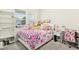Bright bedroom featuring a plush, character-themed bed and ample natural light from the large window at 501 Campbell Ridge Pl, Wendell, NC 27591