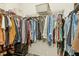 Walk-in closet with ample hanging space, shelves, and storage options for organized and accessible wardrobe at 501 Campbell Ridge Pl, Wendell, NC 27591