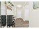 Bright entryway features wood-look flooring and a convenient shoe rack at 501 Campbell Ridge Pl, Wendell, NC 27591
