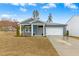 Charming one-story home with a manicured lawn and inviting front porch at 501 Campbell Ridge Pl, Wendell, NC 27591