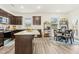 Modern kitchen with stainless appliances and a dining area at 501 Campbell Ridge Pl, Wendell, NC 27591