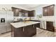 Well-equipped kitchen with stainless steel appliances and a granite countertop island at 501 Campbell Ridge Pl, Wendell, NC 27591
