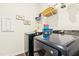 Functional laundry room with modern appliances, storage shelves, and ample space for efficient laundry tasks at 501 Campbell Ridge Pl, Wendell, NC 27591