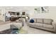 Open concept living room with modern furnishings and a view into the kitchen at 501 Campbell Ridge Pl, Wendell, NC 27591