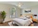 Bedroom with large window, stylish decor, and wood laminate flooring at 505 #106 Alamance Rd, Burlington, NC 27215