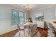 Cozy dining area with chandelier, large window, and natural light at 505 #106 Alamance Rd, Burlington, NC 27215