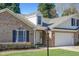 Charming brick home with manicured lawn, two-car garage, and covered entrance at 505 #106 Alamance Rd, Burlington, NC 27215