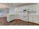 Well-lit kitchen with white cabinets, modern appliances, and tile backsplash at 505 #106 Alamance Rd, Burlington, NC 27215