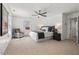 Spacious bedroom with carpet, ceiling fan, and bright natural light at 613 Canal St, Durham, NC 27701