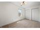 Bright bedroom featuring a large window, a ceiling fan, and a closet for ample storage at 613 Canal St, Durham, NC 27701