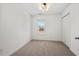 Neutral bedroom with a window and carpet flooring provides a cozy and inviting atmosphere at 613 Canal St, Durham, NC 27701