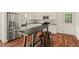 Modern kitchen featuring stainless steel appliances, sleek countertops, and stylish breakfast bar at 613 Canal St, Durham, NC 27701