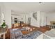 Open-concept living area with hardwood floors, modern decor, and abundant natural light at 613 Canal St, Durham, NC 27701