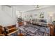 Open-concept living area with hardwood floors, dining area, and comfortable seating at 613 Canal St, Durham, NC 27701