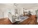 Open-concept living room with hardwood floors and natural light, leading into a modern kitchen at 613 Canal St, Durham, NC 27701