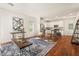 Inviting living area with modern decor, hardwood floors, and open access to the kitchen at 613 Canal St, Durham, NC 27701