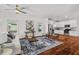 Open-concept living room and kitchen featuring stainless steel appliances, and hardwood floors at 613 Canal St, Durham, NC 27701