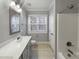 Bathroom with a shower, toilet, and sink with a mirror at 6233 Reagan Ln, Wake Forest, NC 27587