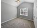 Bedroom with carpet, light grey walls, ceiling fan, and a window with natural light streaming through at 6233 Reagan Ln, Wake Forest, NC 27587