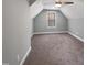 Bedroom with carpet, light grey walls, ceiling fan, and a window with natural light streaming through at 6233 Reagan Ln, Wake Forest, NC 27587