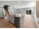 Kitchen features a granite countertop island, stainless steel appliances, and hardwood floors at 6233 Reagan Ln, Wake Forest, NC 27587