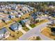 Aerial view of a residential neighborhood featuring well-maintained homes, spacious yards, and quiet streets in a suburban setting at 6817 Osprey Landing Dr, Wendell, NC 27591