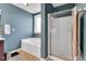 Well-lit bathroom with a soaking tub, glass-enclosed shower, and modern fixtures at 6817 Osprey Landing Dr, Wendell, NC 27591
