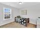 Serene bedroom with a twin bed, large window, and tranquil decor at 6817 Osprey Landing Dr, Wendell, NC 27591