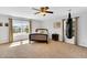 Bright bedroom with a large window, ceiling fan, and a unique punching bag feature at 6817 Osprey Landing Dr, Wendell, NC 27591