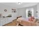 Cozy bedroom with soft pink accents, natural light, and charming decor at 6817 Osprey Landing Dr, Wendell, NC 27591