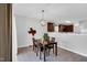 A dining room featuring a wooden table set, chandelier lighting, and a view into the kitchen at 6817 Osprey Landing Dr, Wendell, NC 27591