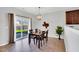 Inviting dining room featuring a sliding glass door to the backyard, and stylish decor at 6817 Osprey Landing Dr, Wendell, NC 27591