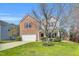 A beautiful home featuring a brick and vinyl exterior with a well-maintained yard at 6817 Osprey Landing Dr, Wendell, NC 27591