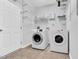 Well-organized laundry room with modern washer and dryer and ample shelving space at 6817 Osprey Landing Dr, Wendell, NC 27591
