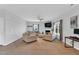 Spacious living room with neutral tones, fireplace, and large windows offers comfortable seating and natural light at 6817 Osprey Landing Dr, Wendell, NC 27591